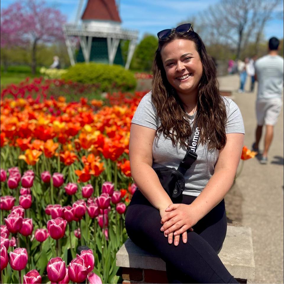 Picture of Shanelle Bender LCSW next to tulips